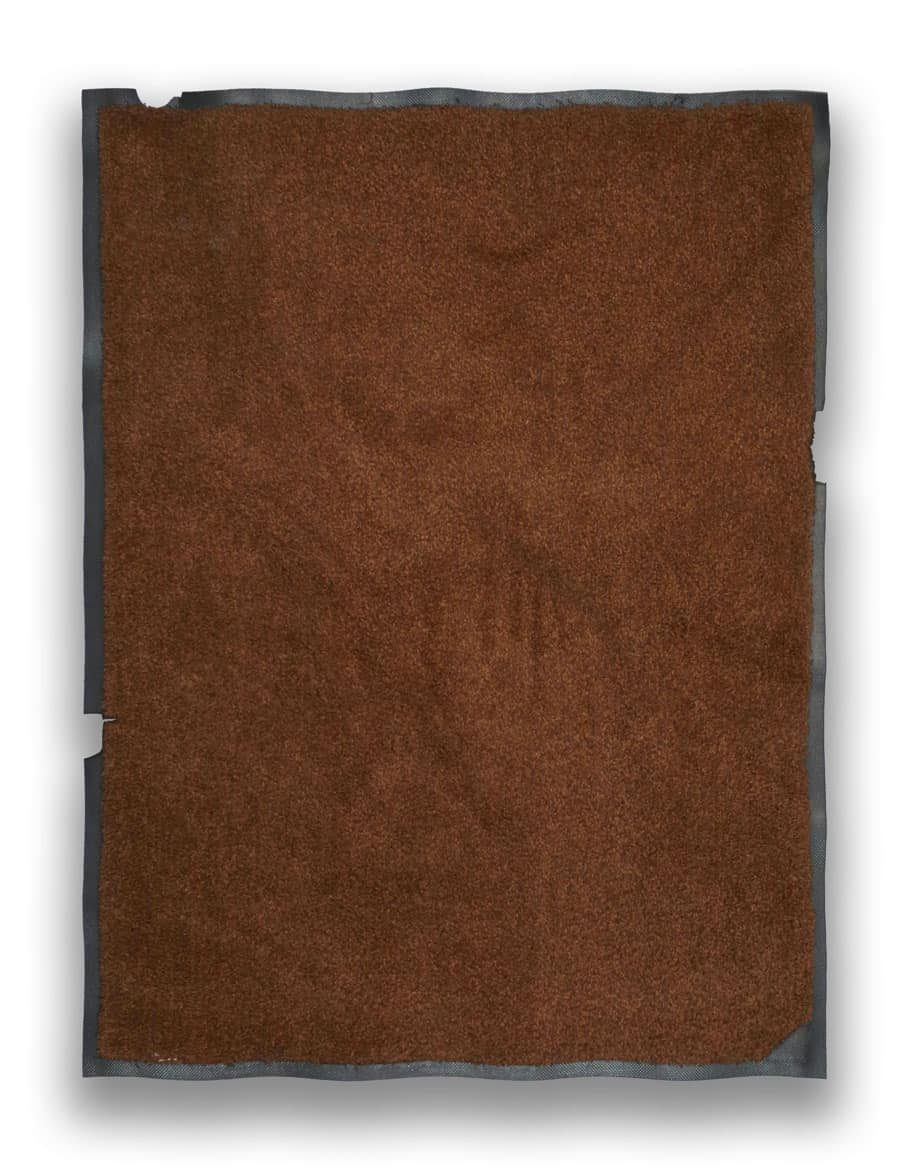 Damaged brown mat before remanufacturing
