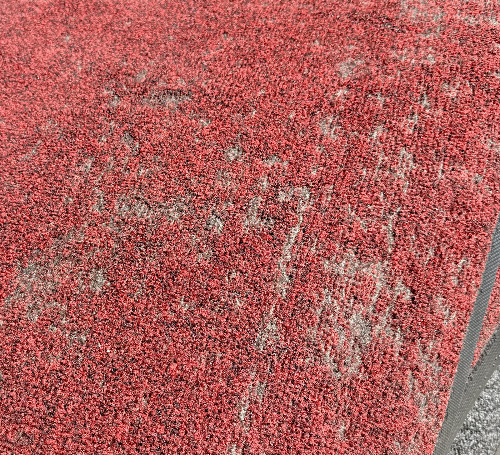 Mat with damaged carpet pile